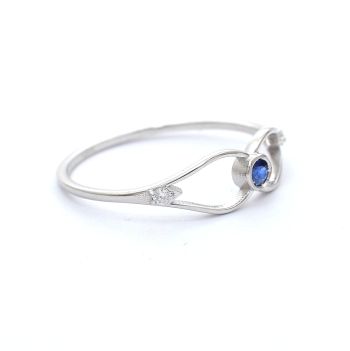 White gold ring with diamonds 0.03 ct and sapphyre 0.06 ct